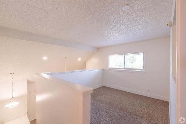 Carpeted room at Avia Lofts at Maple Road, New York